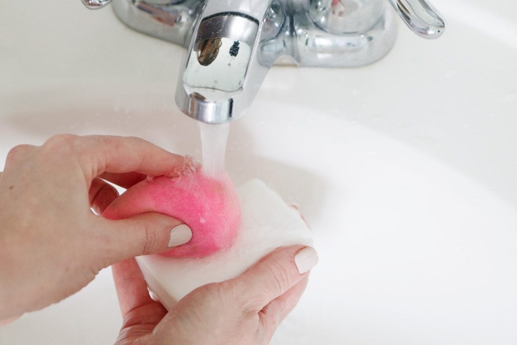 Rubbing sponge with soap - How to Clean Beauty Blender